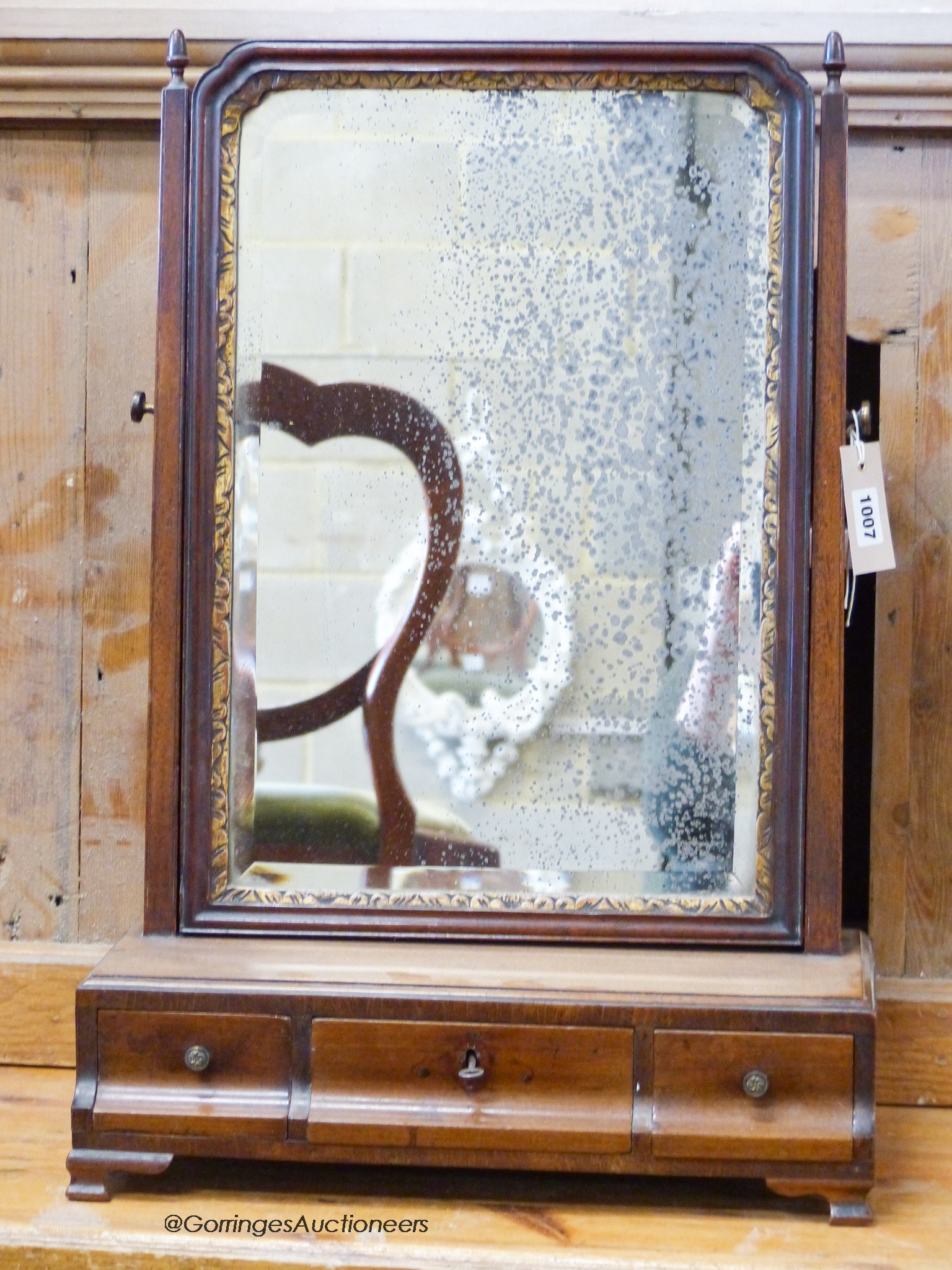 An early 18th century walnut toilet mirror, W.42cm H.63cm